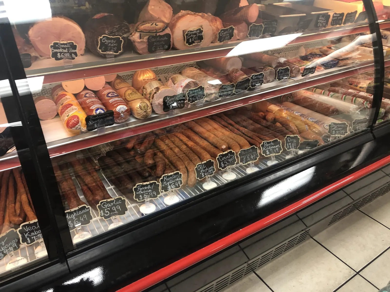 The deli case at European Food Market, lined with sausages, kielbasa and smoked meats