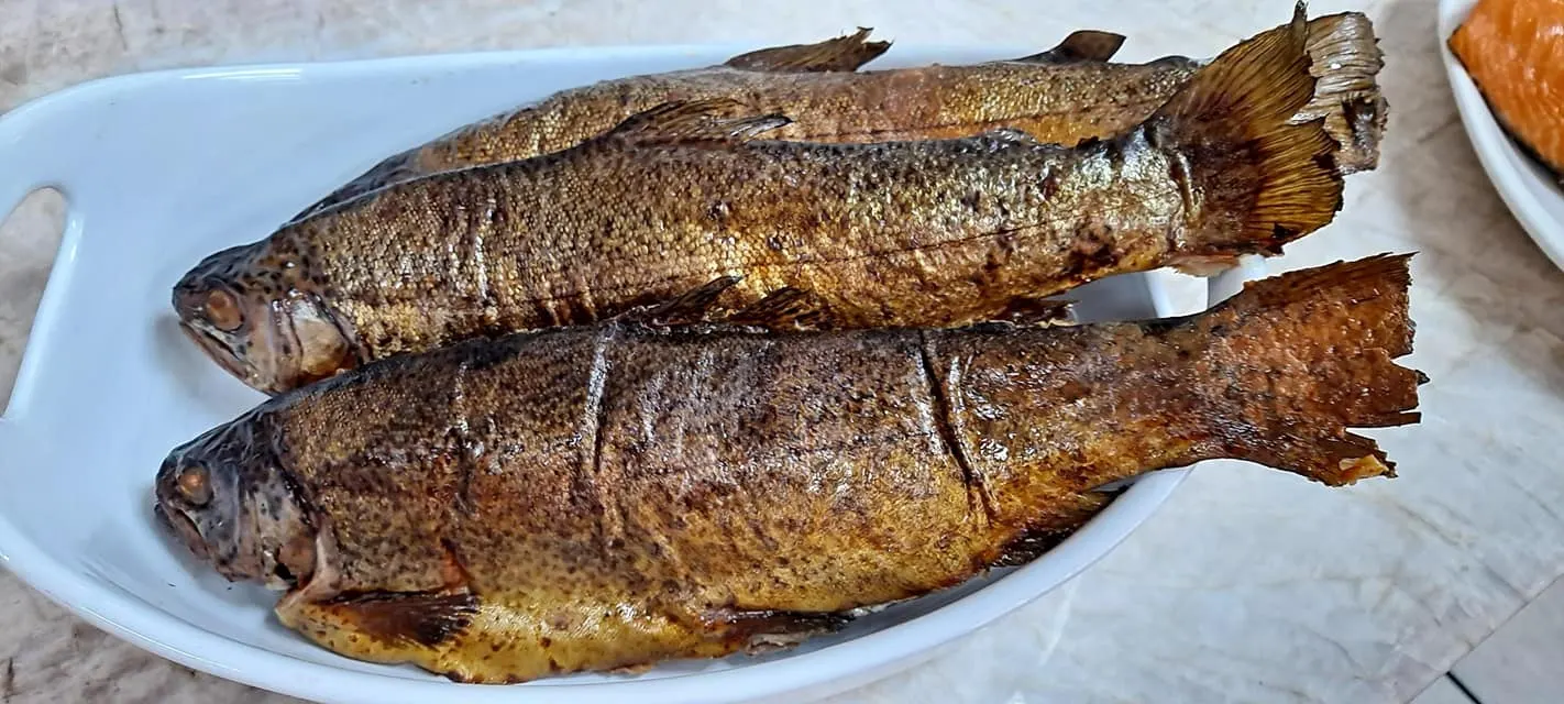Whole smoked fish on a platter