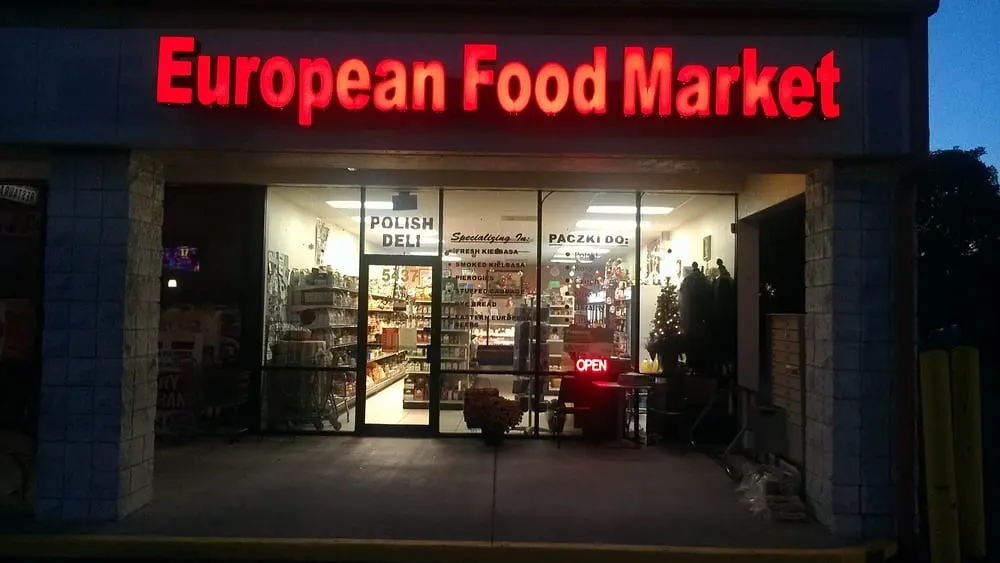 The storefront lit up at night
